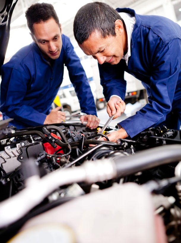 auto-mechanics-repairing-car-engine-at-workshop-2026-04-14-00-47-01-utc