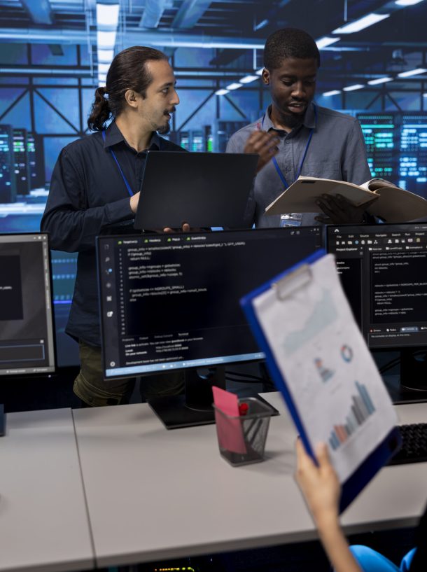 Man inspecting server hub infrastructure, reading paperwork from folder, talking with workers. Supervisor doing evaluation of data center facility workspace, verifying documents